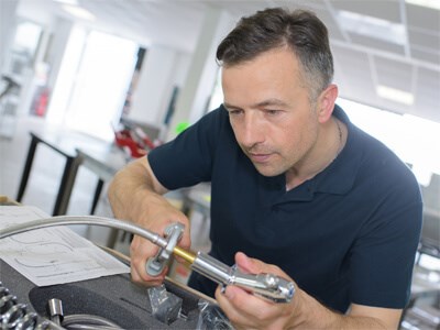 Plumber installing a new pair of faucets